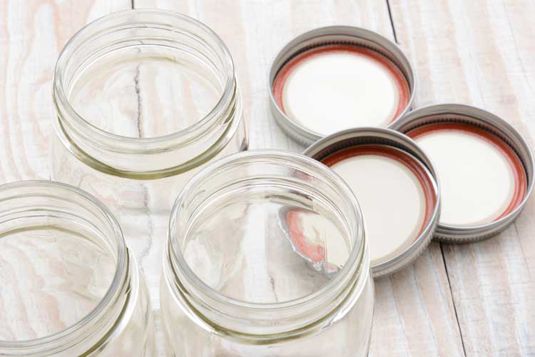 Three empty jars with their lids