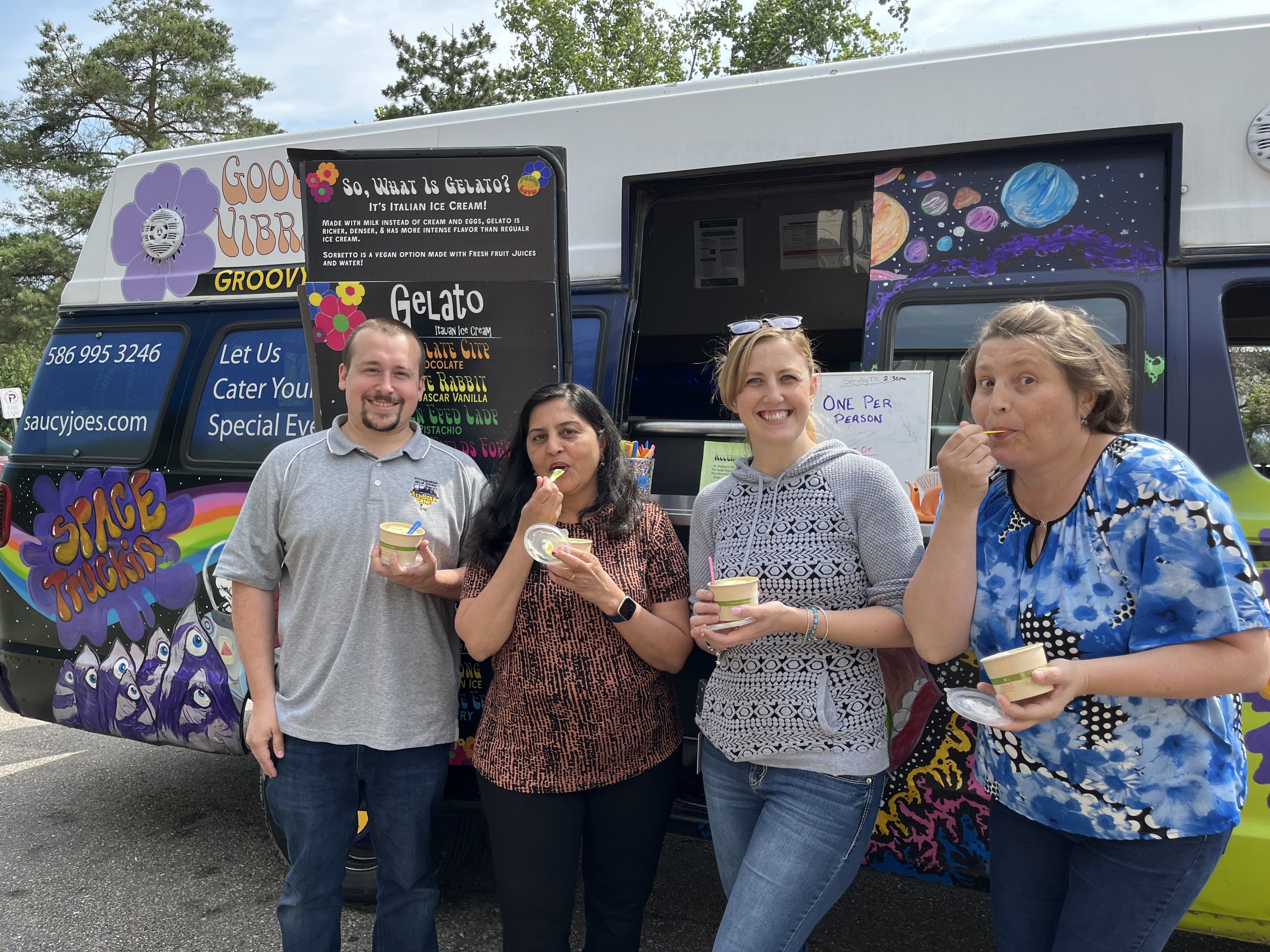 Group of office workers with ice cream from Good Vibrations Gelato Truck