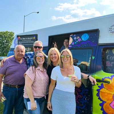 Family in front of Good Vibrations Gelato Truck at party