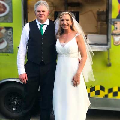 Bride and Groom in fron tof Saucy Joe's Food Truck